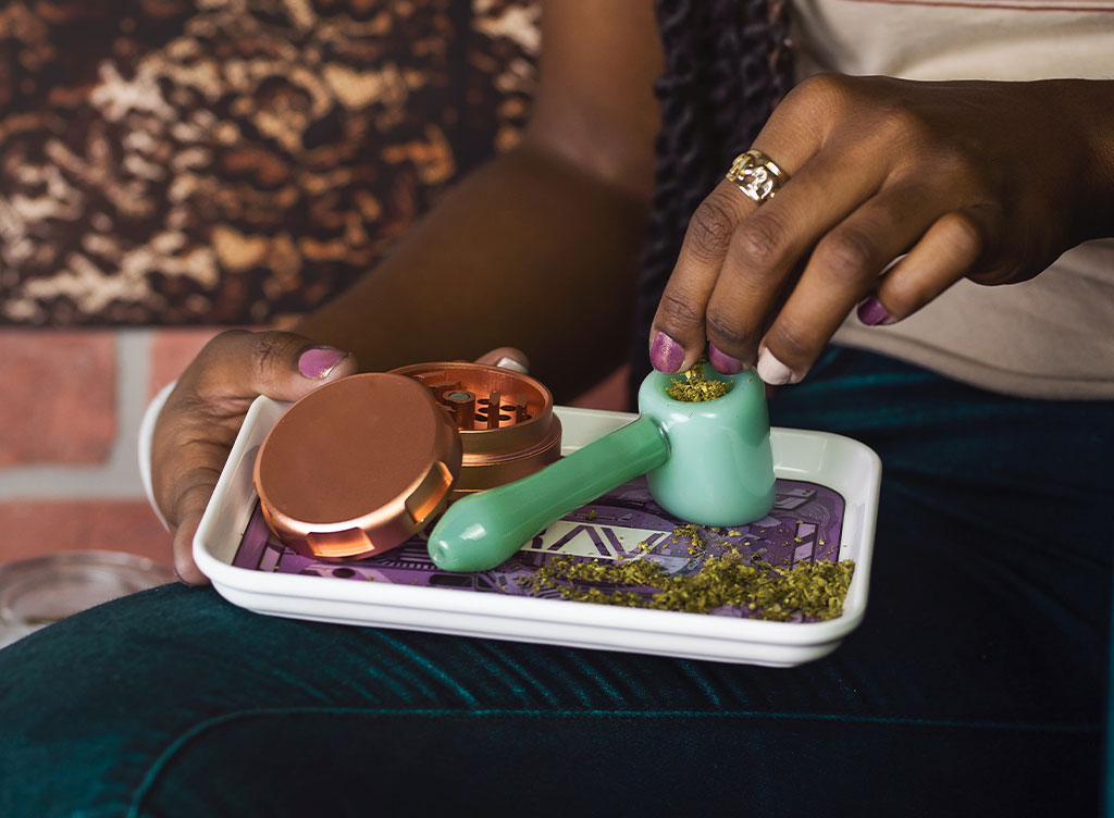 A Glass pipe and Cannabis Grinder with Medical Marijuana