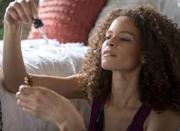 A Woman using a Medical Marijuana Cannabis Tincture