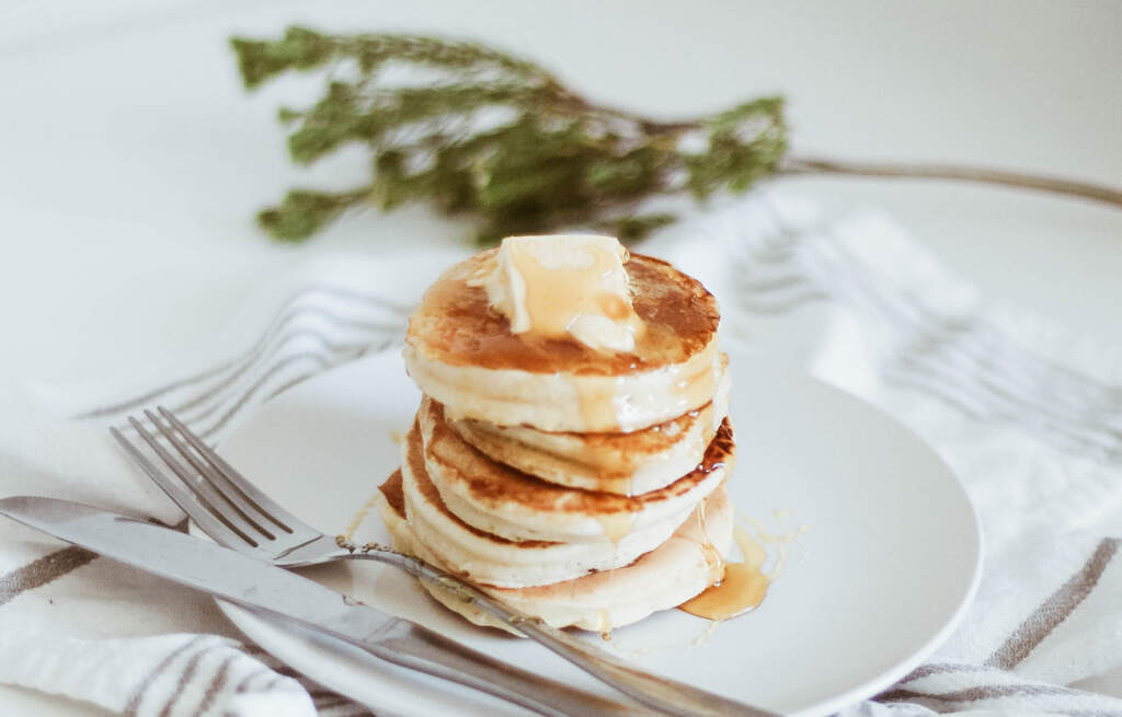 cannabutter on top of pancakes with syrup